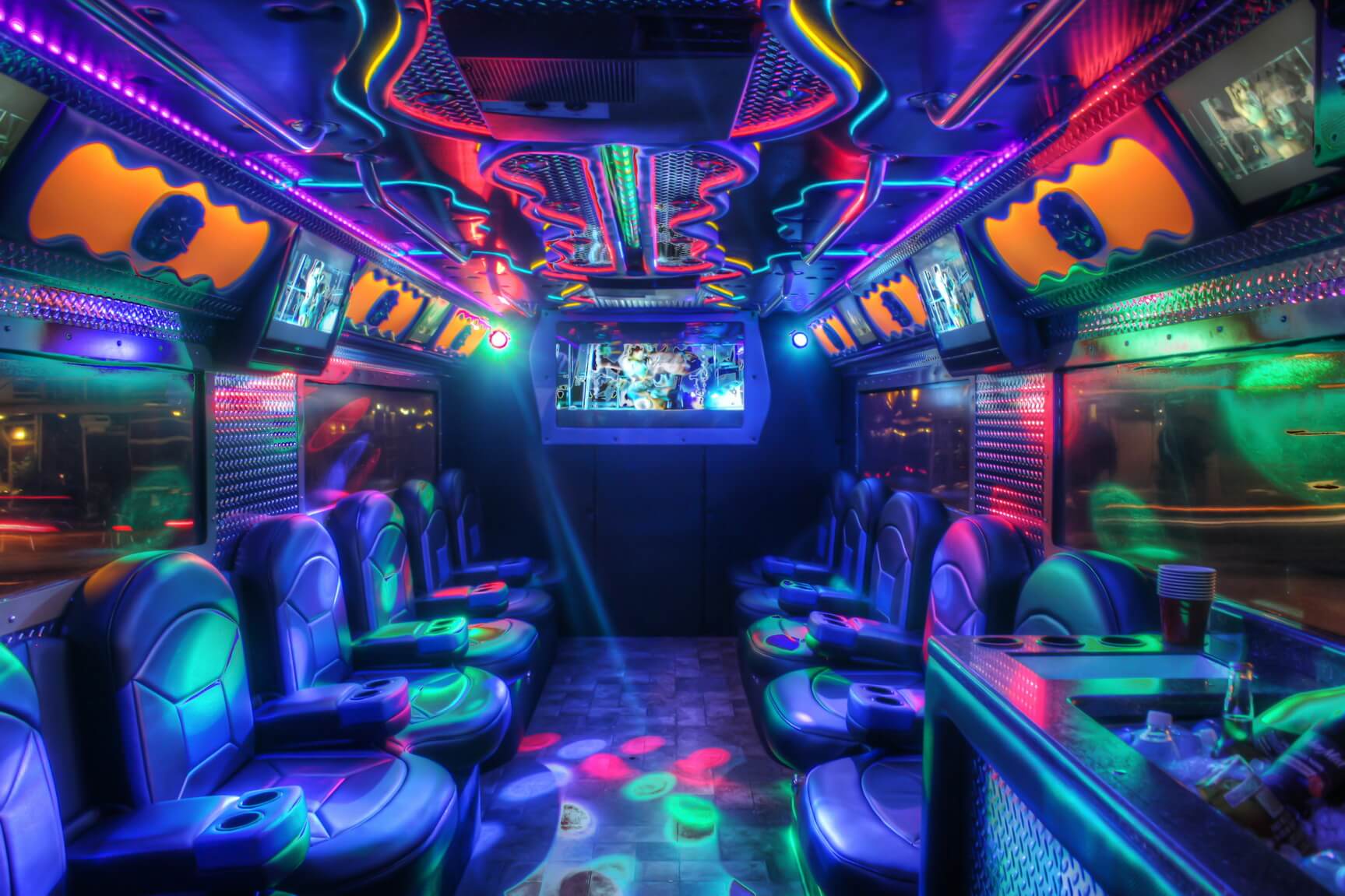 Interior of a Clean Ride Limo party bus with neon lighting